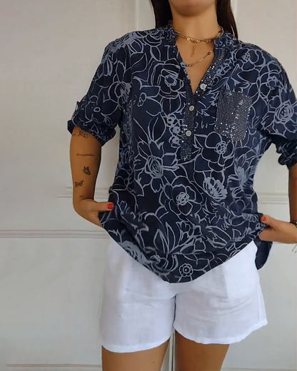 Kélya | Blusa amplia con estampado floral y detalles brillantes