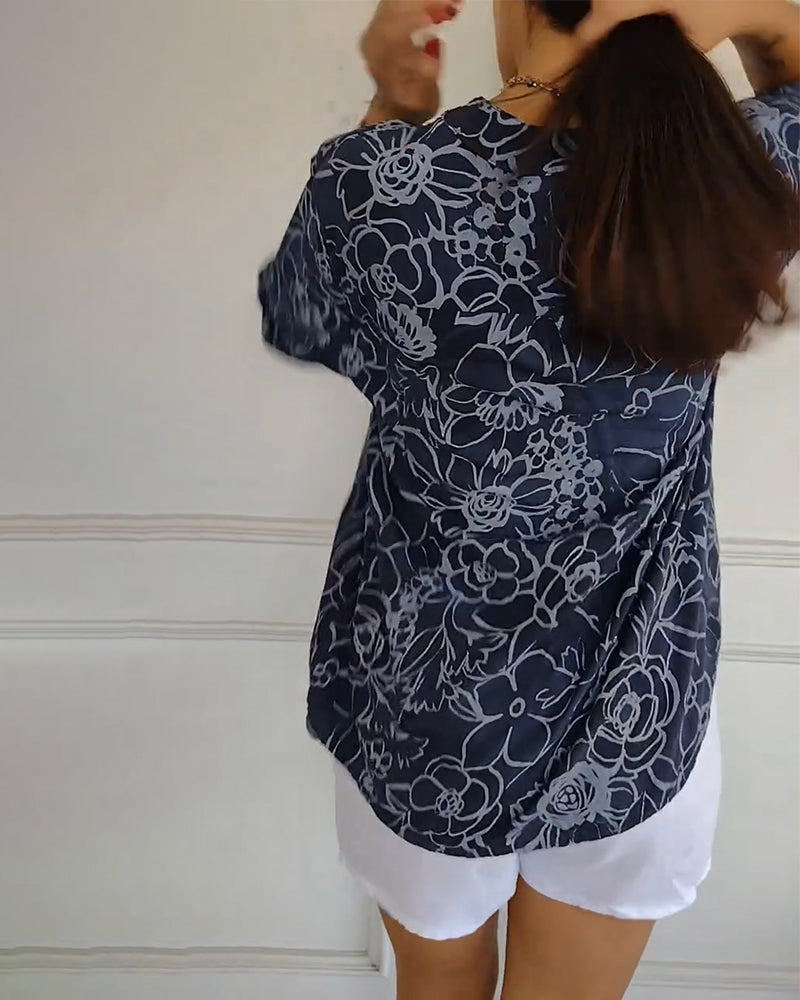 Kélya | Blusa amplia con estampado floral y detalles brillantes